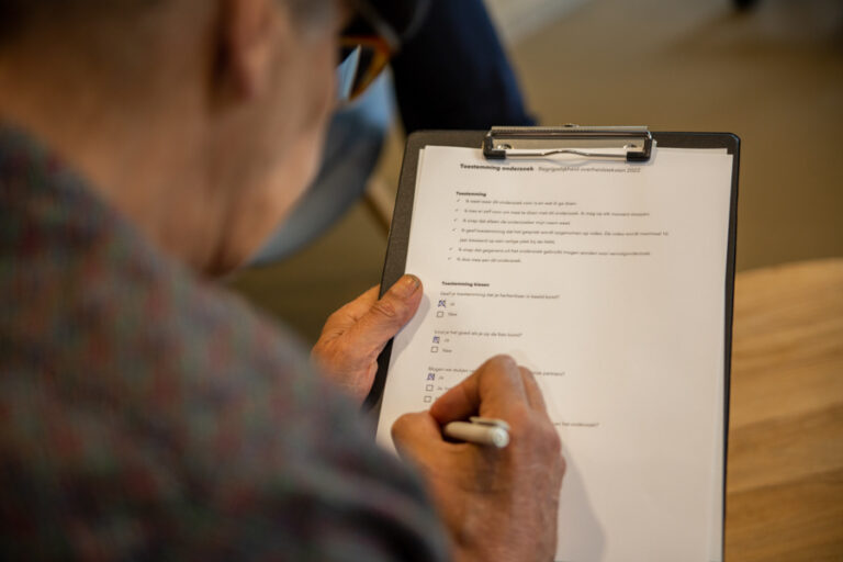 Person signing a consent form